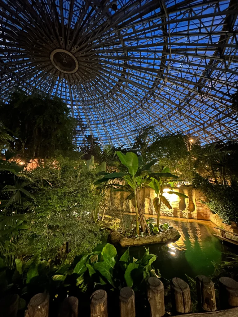 Tropical greenhouse lit up at night at ZooParc de Beauval